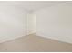 Bright carpeted bedroom with neutral walls and natural light from the window at 16081 W Remuda Dr, Surprise, AZ 85387