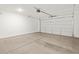Spacious two-car garage with an automatic door, ready for vehicles and storage at 16081 W Remuda Dr, Surprise, AZ 85387