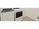 Laundry room featuring modern washer and dryer appliances and tile flooring at 16081 W Remuda Dr, Surprise, AZ 85387