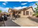 Wide backyard showcasing a patio area with a hot tub and dining space, great for outdoor living at 17696 N 168Th Dr, Surprise, AZ 85374