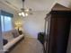Cozy bedroom with neutral colors, a ceiling fan, and a large closet at 17696 N 168Th Dr, Surprise, AZ 85374