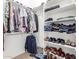 Organized walk-in closet with shelving for clothes, shoes, and accessories at 17696 N 168Th Dr, Surprise, AZ 85374