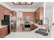 Well-equipped kitchen with stainless steel appliances, stone countertops, and ample cabinet space at 17696 N 168Th Dr, Surprise, AZ 85374