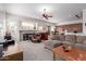 Open living space features a large sofa, fireplace, and bar area with backyard access at 17696 N 168Th Dr, Surprise, AZ 85374