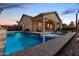 Backyard pool with seating area and covered patio at 17696 N 168Th Dr, Surprise, AZ 85374
