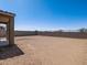 Spacious, dirt backyard surrounded by block wall offering privacy and potential for landscaping at 17809 W Elm St, Goodyear, AZ 85395