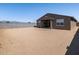 Large, blank-slate backyard with block wall and covered patio at 17809 W Elm St, Goodyear, AZ 85395