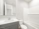 Bathroom features modern vanity, subway tile shower, and neutral color palette at 17809 W Elm St, Goodyear, AZ 85395
