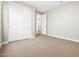 Bedroom with fresh neutral carpeting and a double-door closet at 17809 W Elm St, Goodyear, AZ 85395