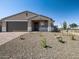 Charming single-story home with a well-maintained gravel yard and a two-car garage, perfect for suburban living at 17809 W Elm St, Goodyear, AZ 85395