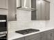 This kitchen features stainless steel appliances, gray cabinets and white countertops, making it a great place to cook at 17809 W Elm St, Goodyear, AZ 85395