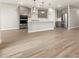 Spacious open living space features tile flooring and connects to the kitchen at 17809 W Elm St, Goodyear, AZ 85395