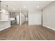 Open concept living space featuring tile flooring and view to kitchen at 17809 W Elm St, Goodyear, AZ 85395