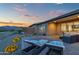 Spacious backyard with mountain views, lounge chairs, desert landscaping, and seamless indoor-outdoor living at 18332 E Spring Valley Ct, Rio Verde, AZ 85263
