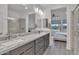 Bathroom with double vanity, granite countertops, and glass shower with a view to the bedroom at 18332 E Spring Valley Ct, Rio Verde, AZ 85263