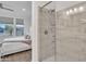 Elegant bathroom features a glass enclosed shower with tile surround and modern fixtures at 18332 E Spring Valley Ct, Rio Verde, AZ 85263
