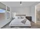 Modern bedroom with neutral tones, stylish furniture, and an attached bathroom with glass shower at 18332 E Spring Valley Ct, Rio Verde, AZ 85263