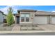 Beautiful home with neutral tones, manicured landscape, and a spacious two-car garage at 18332 E Spring Valley Ct, Rio Verde, AZ 85263