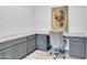 Dedicated office space with gray cabinetry, granite countertops, and a stylish chair at 18332 E Spring Valley Ct, Rio Verde, AZ 85263
