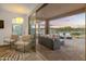 Cozy outdoor patio with comfortable seating offers scenic sunset views and a seamless indoor-outdoor living experience at 18332 E Spring Valley Ct, Rio Verde, AZ 85263