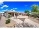 Large backyard with desert landscaping and covered patio, perfect for outdoor living at 19245 W Pasadena Ave, Litchfield Park, AZ 85340