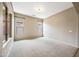 Spacious bedroom with neutral carpet, multiple windows, and natural lighting at 19245 W Pasadena Ave, Litchfield Park, AZ 85340