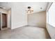 Spacious bedroom with ceiling fan, adjacent rooms and neutral tones throughout at 19245 W Pasadena Ave, Litchfield Park, AZ 85340