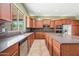 Bright kitchen featuring granite countertops and stainless steel appliances at 19245 W Pasadena Ave, Litchfield Park, AZ 85340