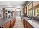 Open kitchen layout with an island and connection to the living room at 19245 W Pasadena Ave, Litchfield Park, AZ 85340