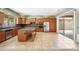 Modern kitchen featuring stainless steel appliances, custom cabinets, and a spacious island, perfect for culinary enthusiasts at 19245 W Pasadena Ave, Litchfield Park, AZ 85340