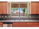 The kitchen sink features a large window overlooking the backyard at 19245 W Pasadena Ave, Litchfield Park, AZ 85340