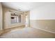 Bright living room with neutral tones, lots of light and archways throughout at 19245 W Pasadena Ave, Litchfield Park, AZ 85340
