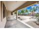 Covered patio with ample space for outdoor entertaining, overlooking a large yard at 19245 W Pasadena Ave, Litchfield Park, AZ 85340