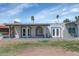 Charming single-story home with covered patio and manicured lawn at 2119 N Recker Rd, Mesa, AZ 85215
