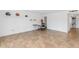 Bright bedroom with tile floors, neutral paint, and a closet for storage at 2119 N Recker Rd, Mesa, AZ 85215