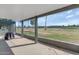 Covered patio showcasing view of backyard, golf course, and desert landscaping at 2119 N Recker Rd, Mesa, AZ 85215