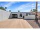 Charming single-story home with a private courtyard, desert landscaping and attached carport at 2119 N Recker Rd, Mesa, AZ 85215