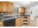 Cozy kitchen featuring tile backsplash, wooden cabinets, and an undermounted sink at 2119 N Recker Rd, Mesa, AZ 85215