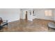 Bright living room featuring neutral paint, tile floors, and an open layout with natural lighting at 2119 N Recker Rd, Mesa, AZ 85215