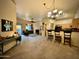 Open-concept living room seamlessly connects to the dining area and kitchen, ideal for modern living at 2150 E Bell Rd # 1113, Phoenix, AZ 85022