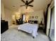 Spacious main bedroom with an ensuite bath, ceiling fan, and access to a patio for a serene retreat at 2150 E Bell Rd # 1113, Phoenix, AZ 85022