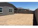 Wide angle view of the backyard area with block wall surround at 24467 W Grenadine Rd, Buckeye, AZ 85326