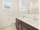 Bathroom with double sink vanity, toilet, and shower at 24467 W Grenadine Rd, Buckeye, AZ 85326