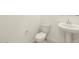 Convenient half-bath features pedestal sink and stylish fixtures at 24467 W Grenadine Rd, Buckeye, AZ 85326