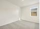 Bedroom with neutral carpet, natural light from window and painted in white at 24467 W Grenadine Rd, Buckeye, AZ 85326