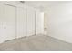 Bright bedroom features neutral carpet, large closet and white paint at 24467 W Grenadine Rd, Buckeye, AZ 85326