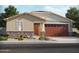 Charming single-story home featuring a two-car garage, desert landscaping, and a welcoming front entrance at 24467 W Grenadine Rd, Buckeye, AZ 85326