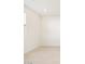 Bright, open living space with neutral tile flooring and recessed lighting provides a flexible layout at 24467 W Grenadine Rd, Buckeye, AZ 85326