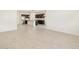 Open concept living area with tile flooring and modern kitchen at 24467 W Grenadine Rd, Buckeye, AZ 85326