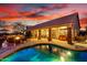 The backyard offers a covered patio, built in bar, and a beautiful pool to enjoy sunset skies at 28802 N 45Th St, Cave Creek, AZ 85331
